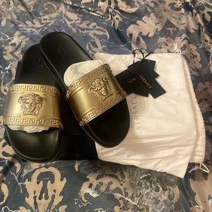 Black and gold Versace slides